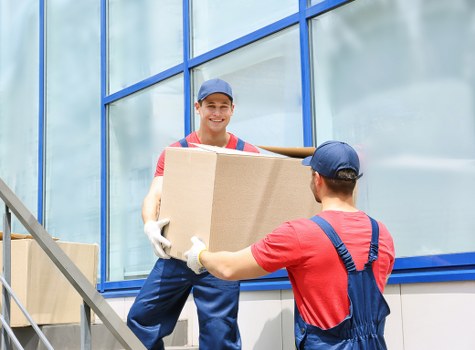 Packed boxes and household furniture prepared for a local move in Belmont