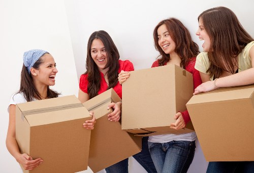 Removalists handling furniture and boxes in Belmont