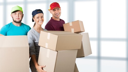 Packed business furniture and labelled boxes ready for transport in Belmont