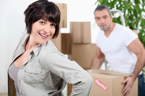 Moving day preparation checklist beside boxes and furniture for a Belmont house move